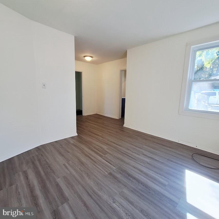 226 Appleby Road New Castle, DE 19720 - Photo 24 of 34 a view of an empty room with wooden floor and a window