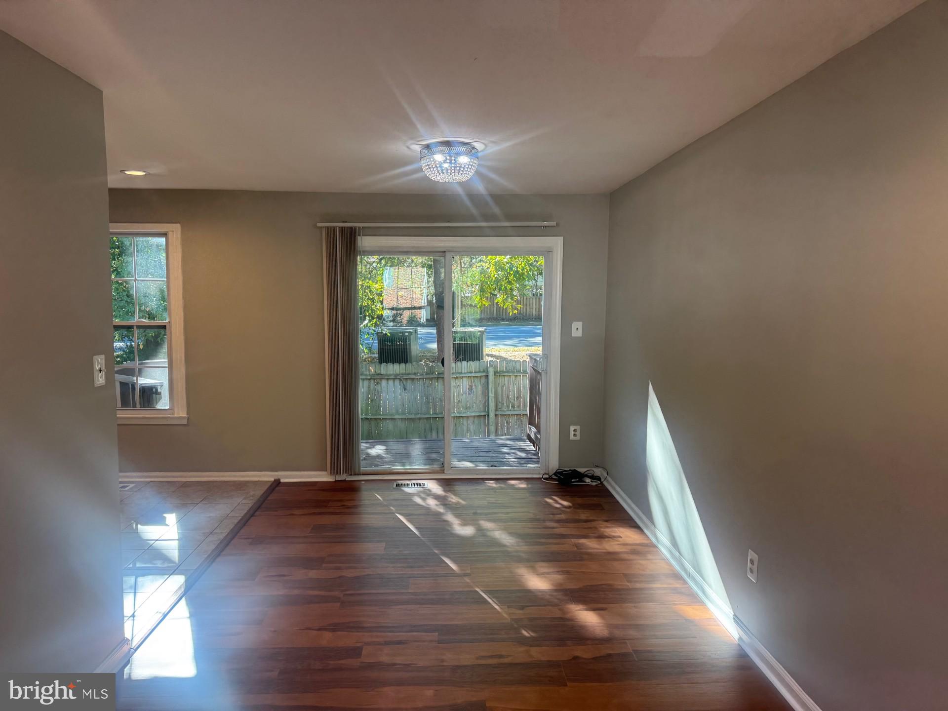 8587 Tyrolean Way Springfield, VA 22153 - Photo 6 of 19 a view of empty room with wooden floor and fan
