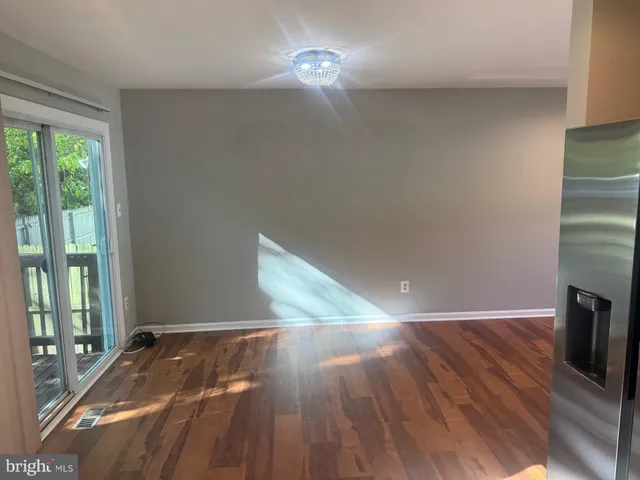 a view of a livingroom with wooden floor