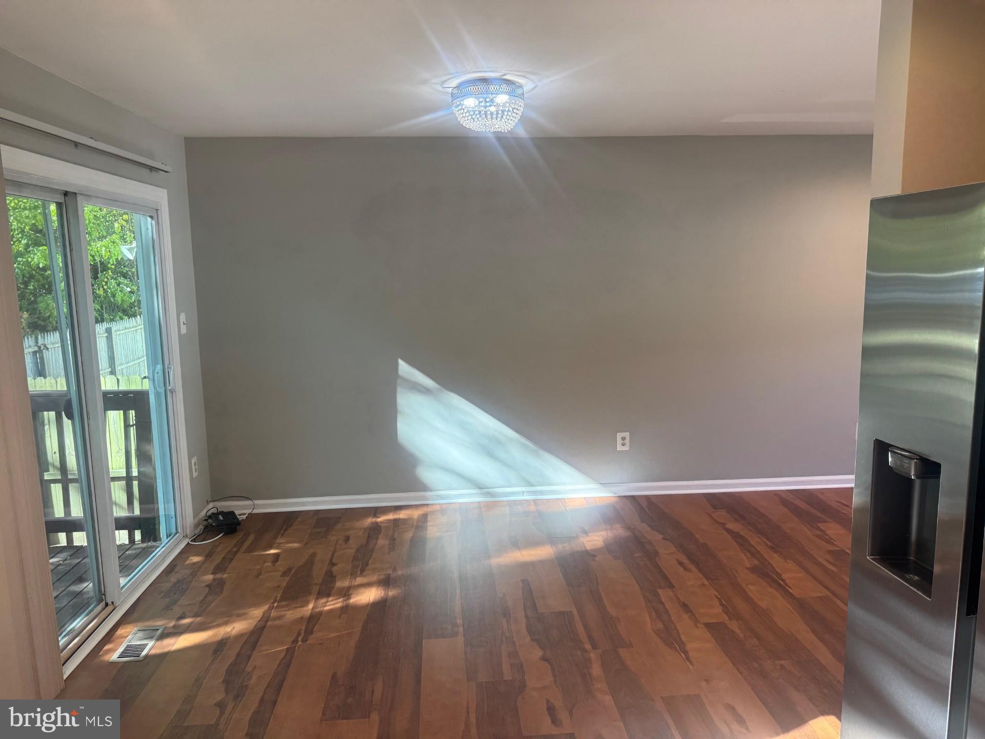 8587 Tyrolean Way Springfield, VA 22153 - Photo 7 of 19 a view of a livingroom with wooden floor