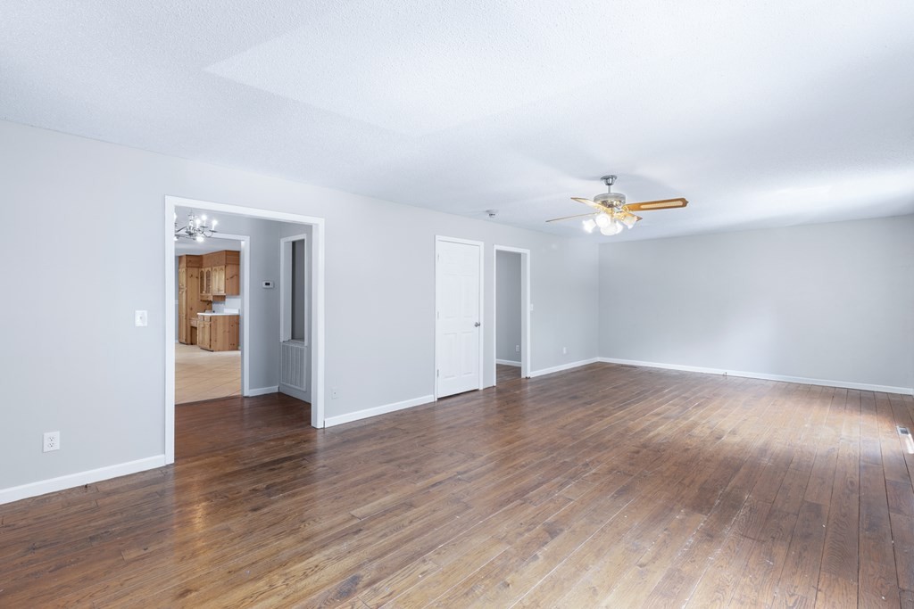 750 Robinson Road Chatsworth, GA 30705 - Photo 3 of 39 a view of an empty room with wooden floor