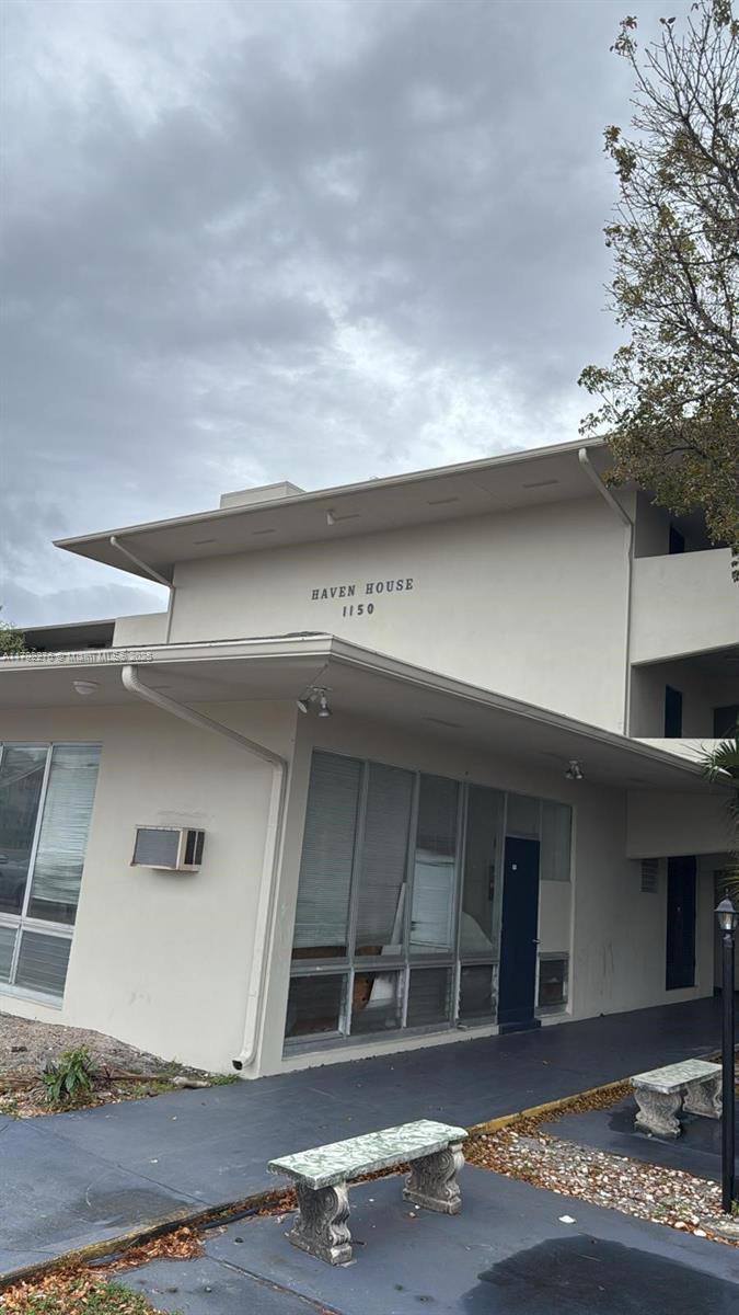 1150 East Sample Road, Unit 312 Pompano Beach, FL 33064 - Photo 1 of 1 a front view of a house