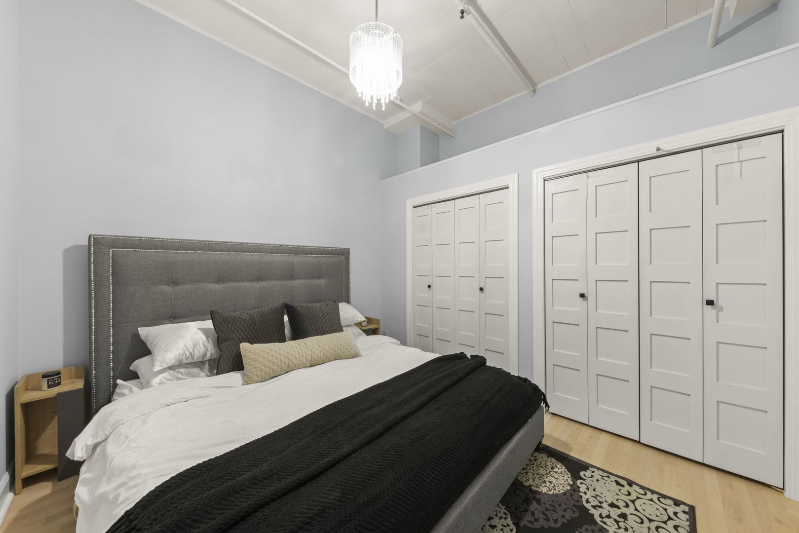 1301 West Madison Street, Unit 305 Chicago, IL 60607 - Photo 13 of 22 a bedroom with a bed and a closet