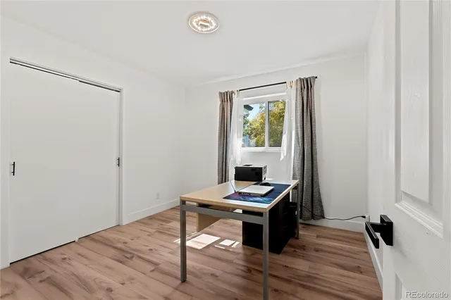 a workspace with furniture and a window