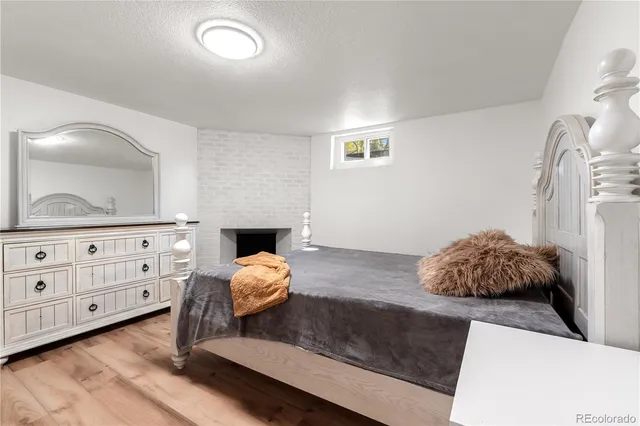 a living room with furniture and mirror