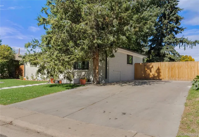 a view of a house with a yard and garage