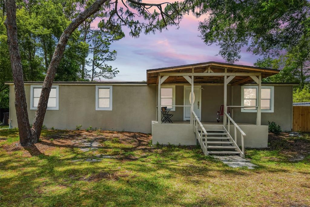 4551 Mitchell Road Land O Lakes, FL 34638 - Photo 1 of 1 a front view of a house with garden