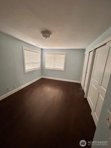 a view of room with window and hardwood floor