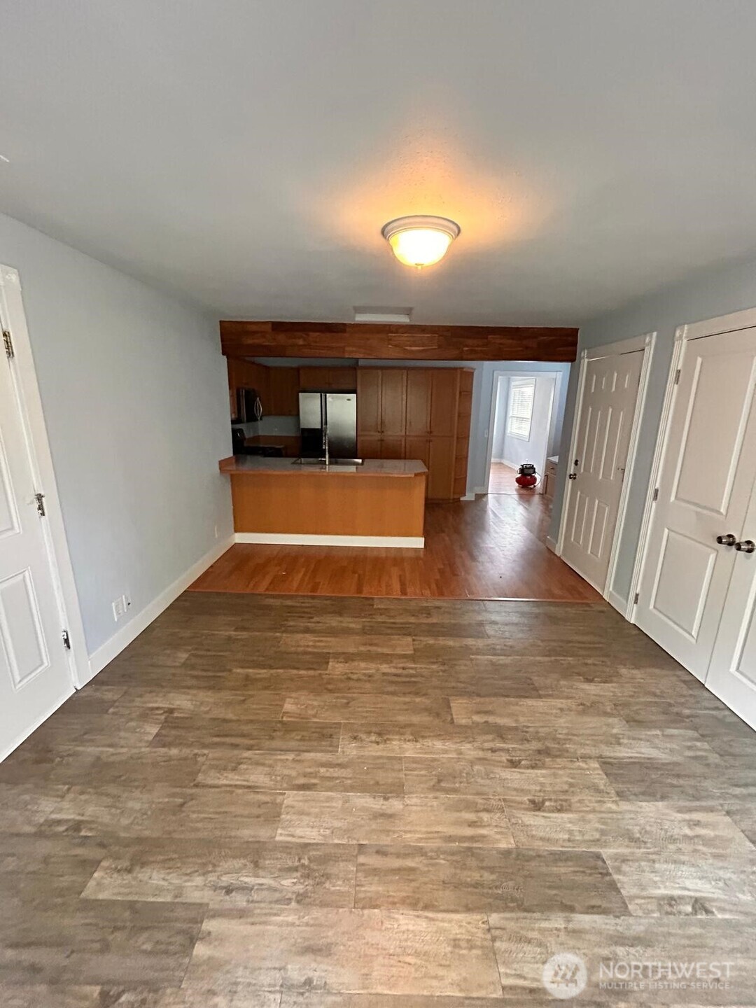 3232 Russet Road Brier, WA 98036 - Photo 6 of 11 a room with wooden floor and furniture