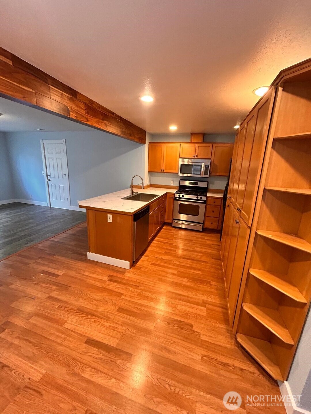 3232 Russet Road Brier, WA 98036 - Photo 7 of 11 a view of kitchen and kitchen with wooden floor