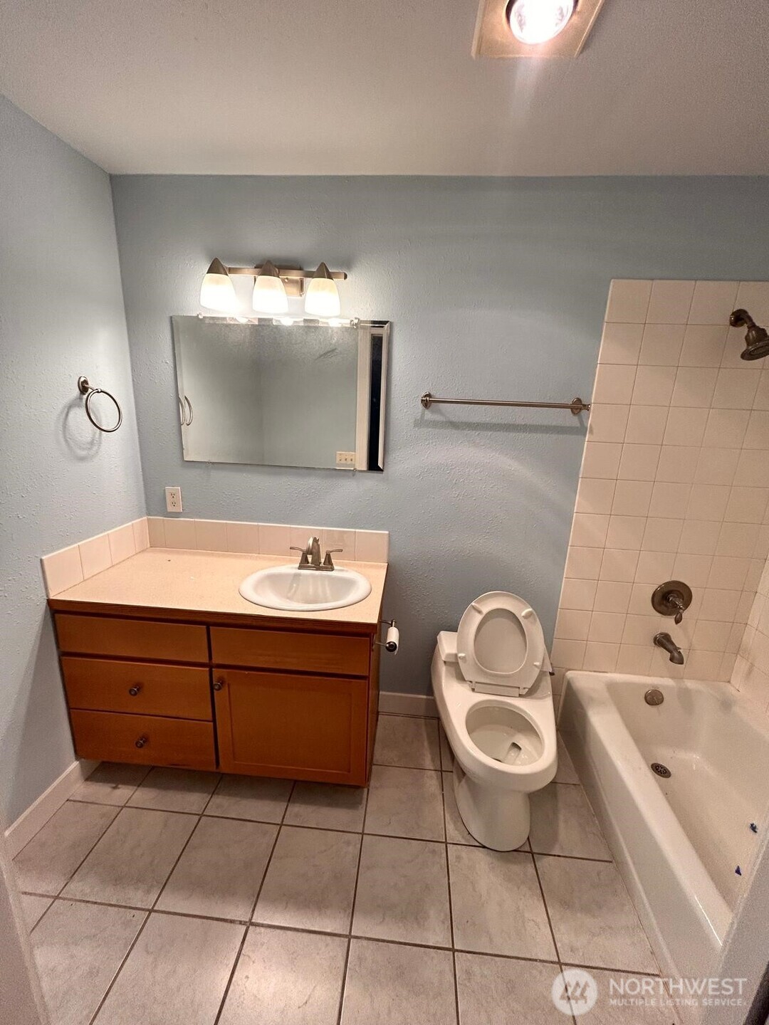 3232 Russet Road Brier, WA 98036 - Photo 9 of 11 a bathroom with a sink toilet and mirror
