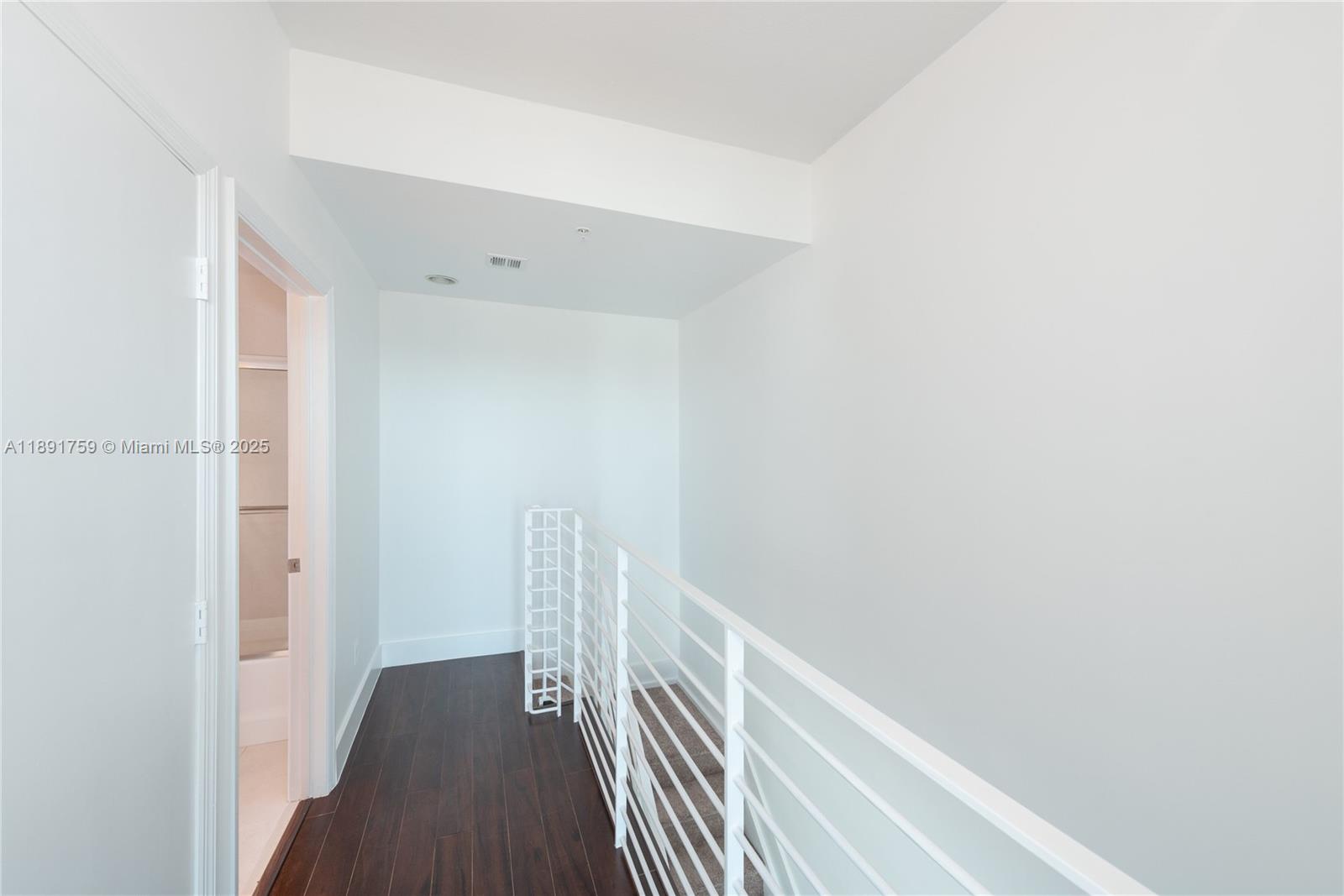 60 Southwest 13th Street, Unit 2017 Miami, FL 33130 - Photo 12 of 23 a view of a hallway with wooden floor