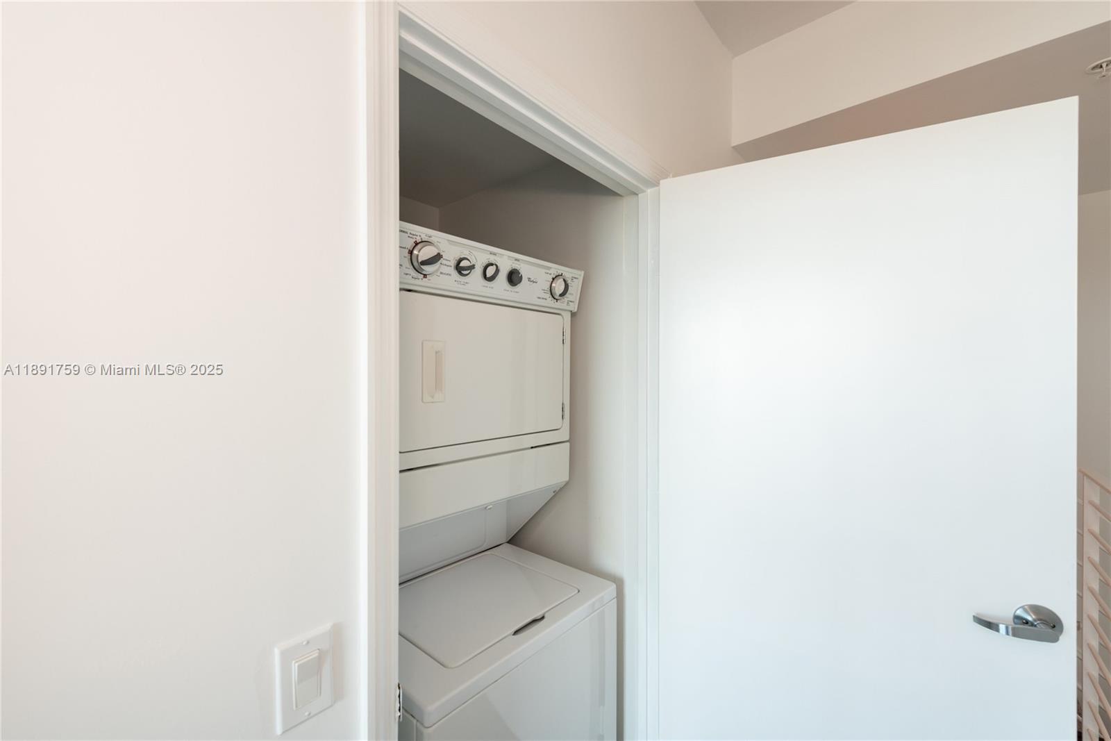 60 Southwest 13th Street, Unit 2017 Miami, FL 33130 - Photo 17 of 23 a utility room with dryer and washer