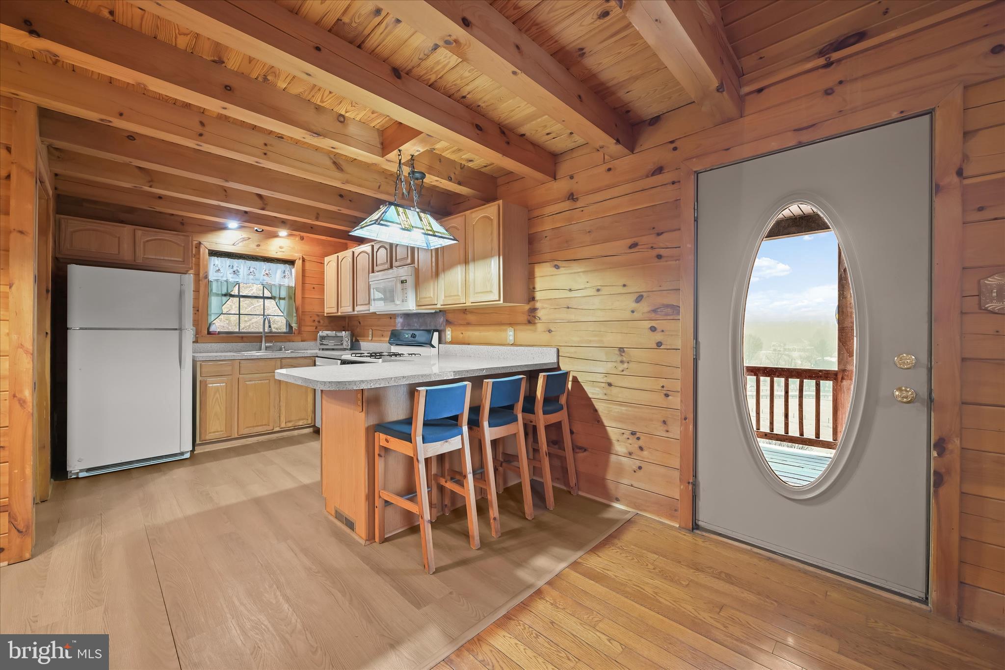 3580 Flickinger Road Westminster, MD 21158 - Photo 12 of 81 a dining room with furniture and a floor to ceiling window