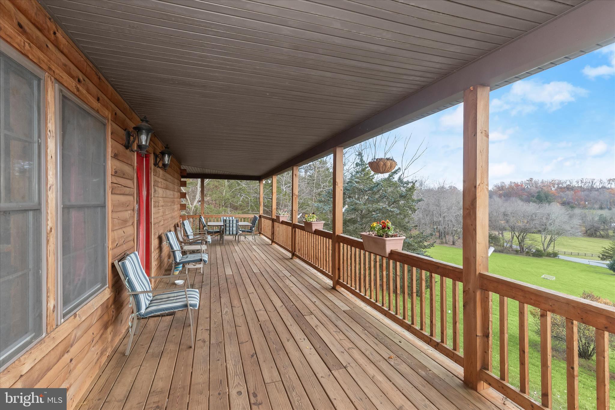 3580 Flickinger Road Westminster, MD 21158 - Photo 43 of 81 a view of a balcony with chairs and wooden floor
