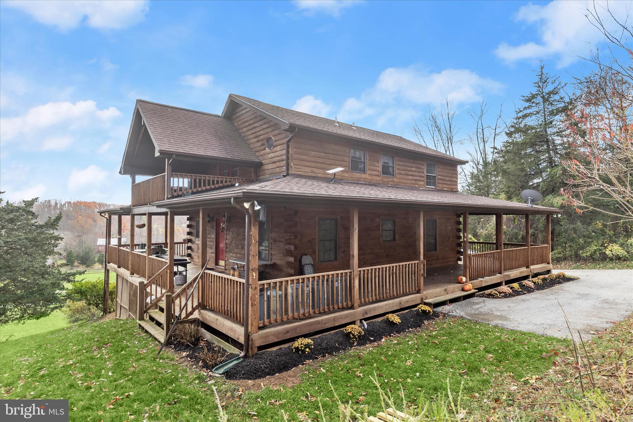 3580 Flickinger Road Westminster, MD 21158 - Photo 48 of 81 a view of a backyard with a wooden deck and a floor to ceiling window
