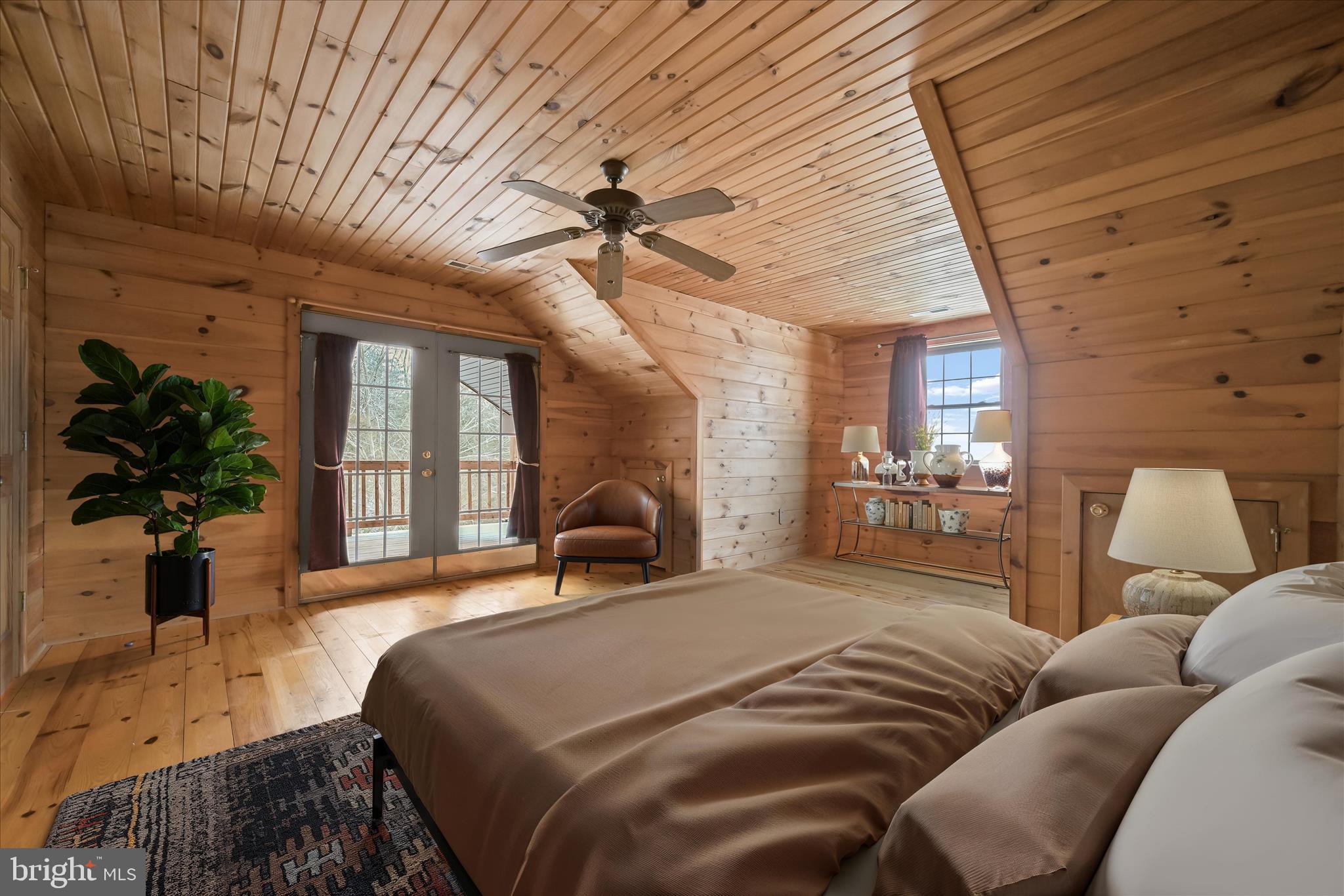 3580 Flickinger Road Westminster, MD 21158 - Photo 5 of 81 a spacious bedroom with a bed a couch and potted plant