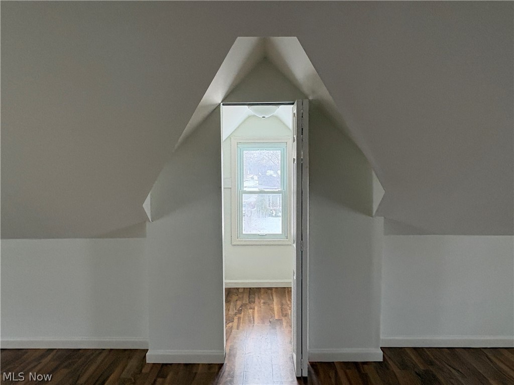 15521 Corkhill Road Maple Heights, OH 44137 - Photo 15 of 33 Bonus room with dark wood-style floors and lofted ceiling