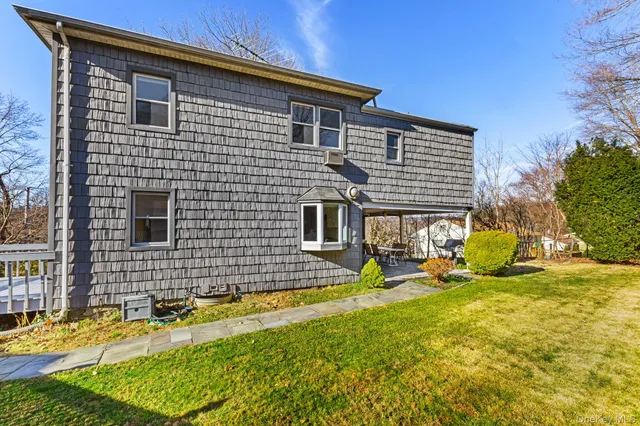a view of house with yard