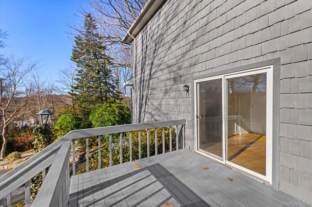 a balcony with wooden floor