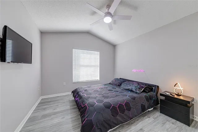 a bedroom with furniture and a window