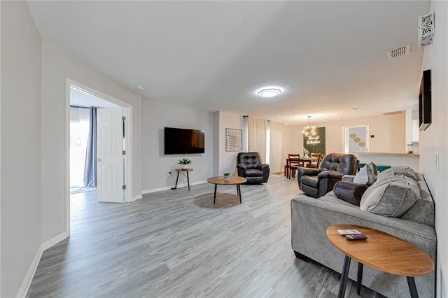 a view of a dining room with furniture and window