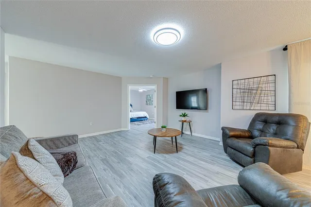 a kitchen with a sink appliances and cabinets