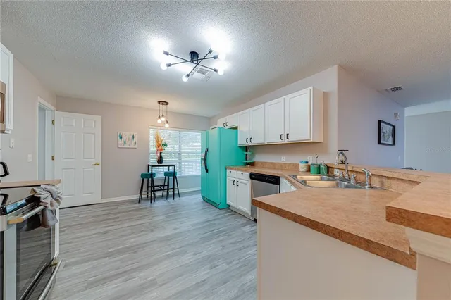 a bedroom with a large bed and a large window