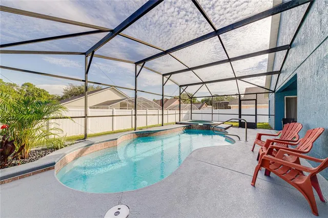 a view of a swimming pool with a lounge chair
