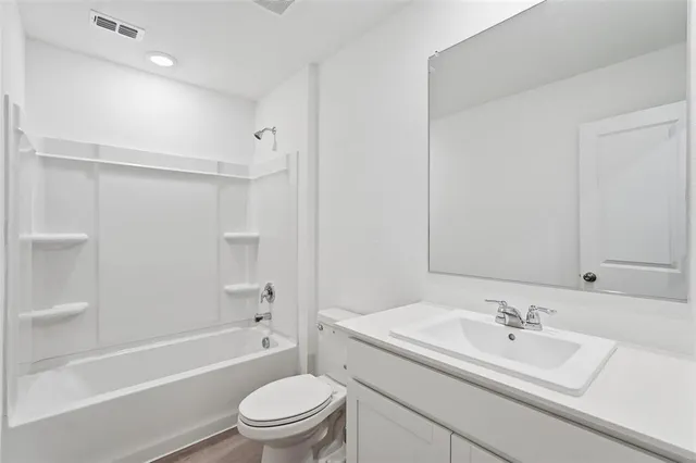 a bathroom with a sink a toilet and a bathtub