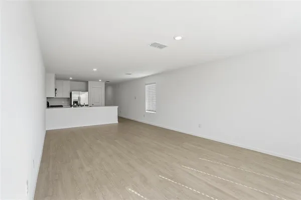 a view of kitchen and kitchen with sink