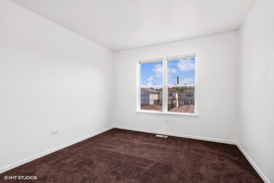 39 East 89th Street Chicago, IL 60619 - Photo 14 of 21 an empty room with a window