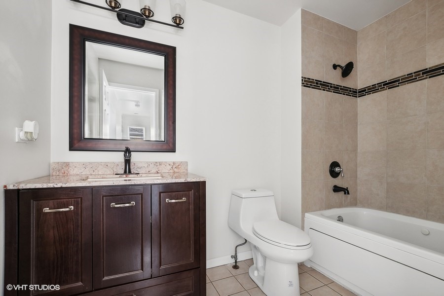 39 East 89th Street Chicago, IL 60619 - Photo 15 of 21 a bathroom with a toilet a sink and a bathtub