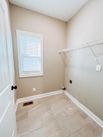 a view of a room with rack on the wall