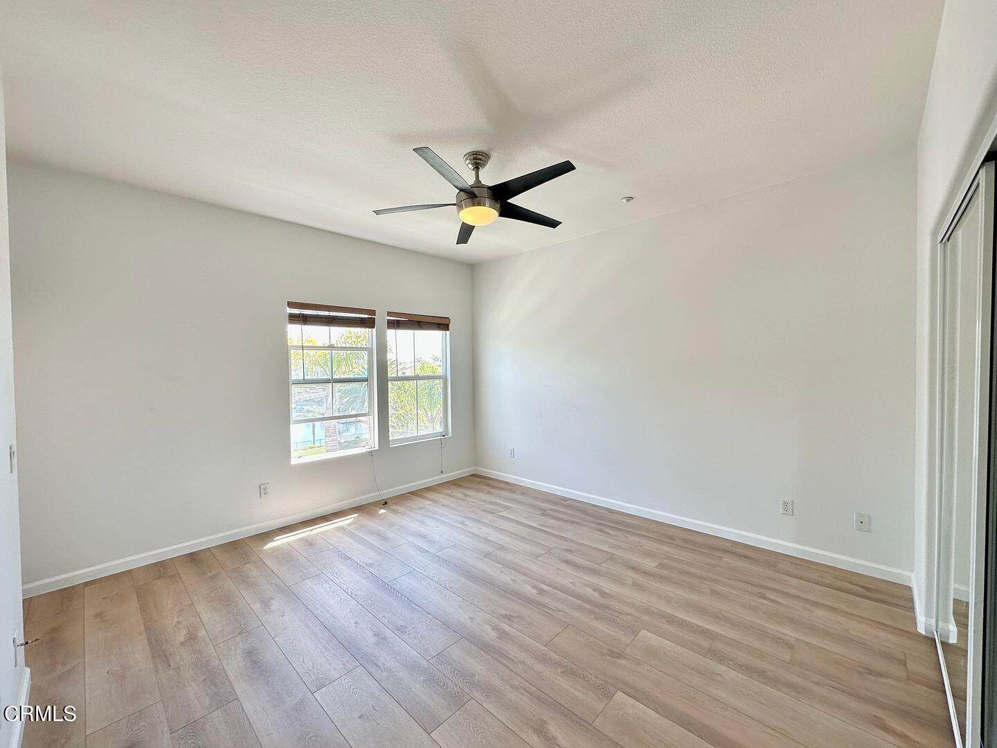 1202 Bayside Circle Oxnard, CA 93035 - Photo 25 of 48 wooden floor in an empty room with a window