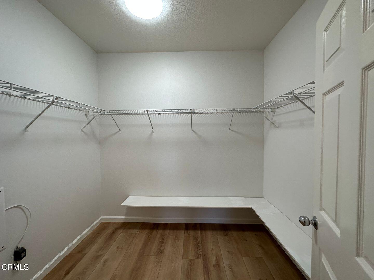 1202 Bayside Circle Oxnard, CA 93035 - Photo 31 of 48 a view of a room with racks on the wall