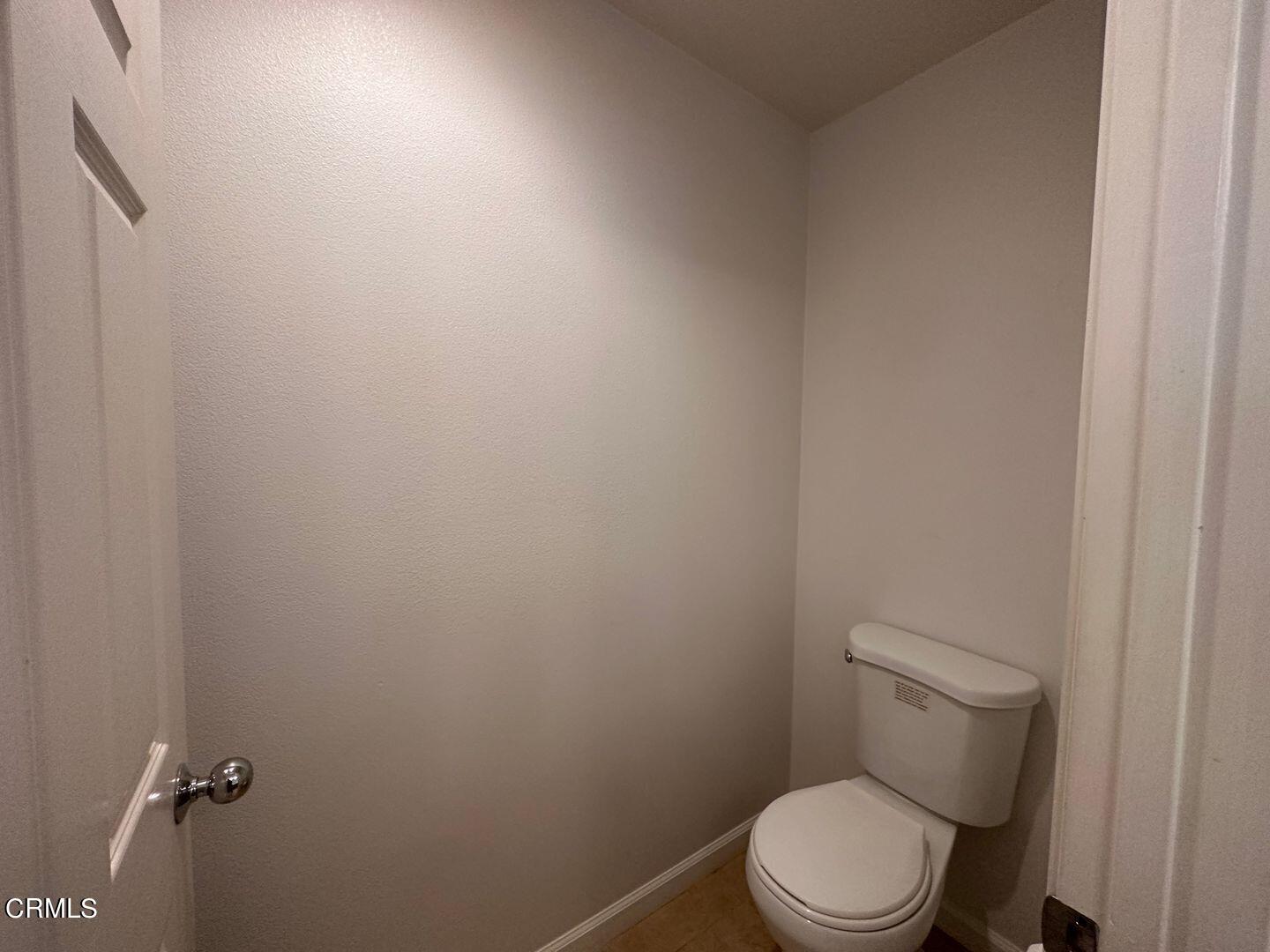1202 Bayside Circle Oxnard, CA 93035 - Photo 32 of 48 a white toilet sitting next to a white wall