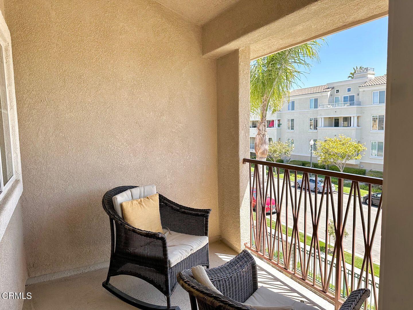 1202 Bayside Circle Oxnard, CA 93035 - Photo 34 of 48 a view of a balcony with chair and table