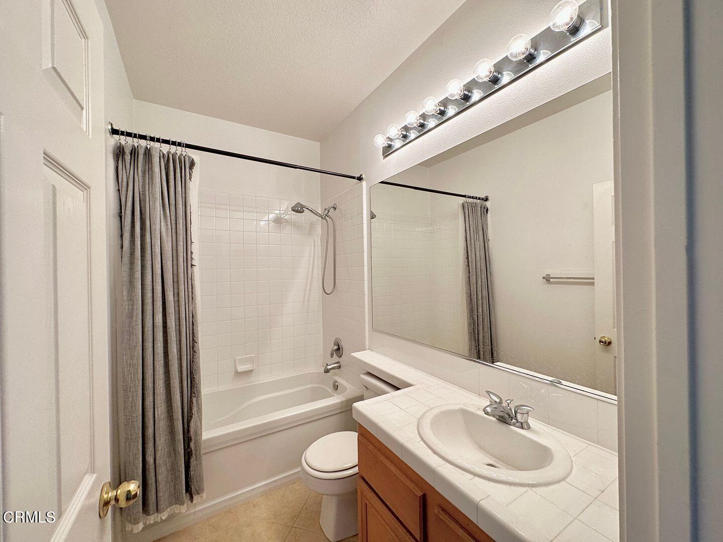 1202 Bayside Circle Oxnard, CA 93035 - Photo 38 of 48 a bathroom with a sink a toilet a mirror and shower