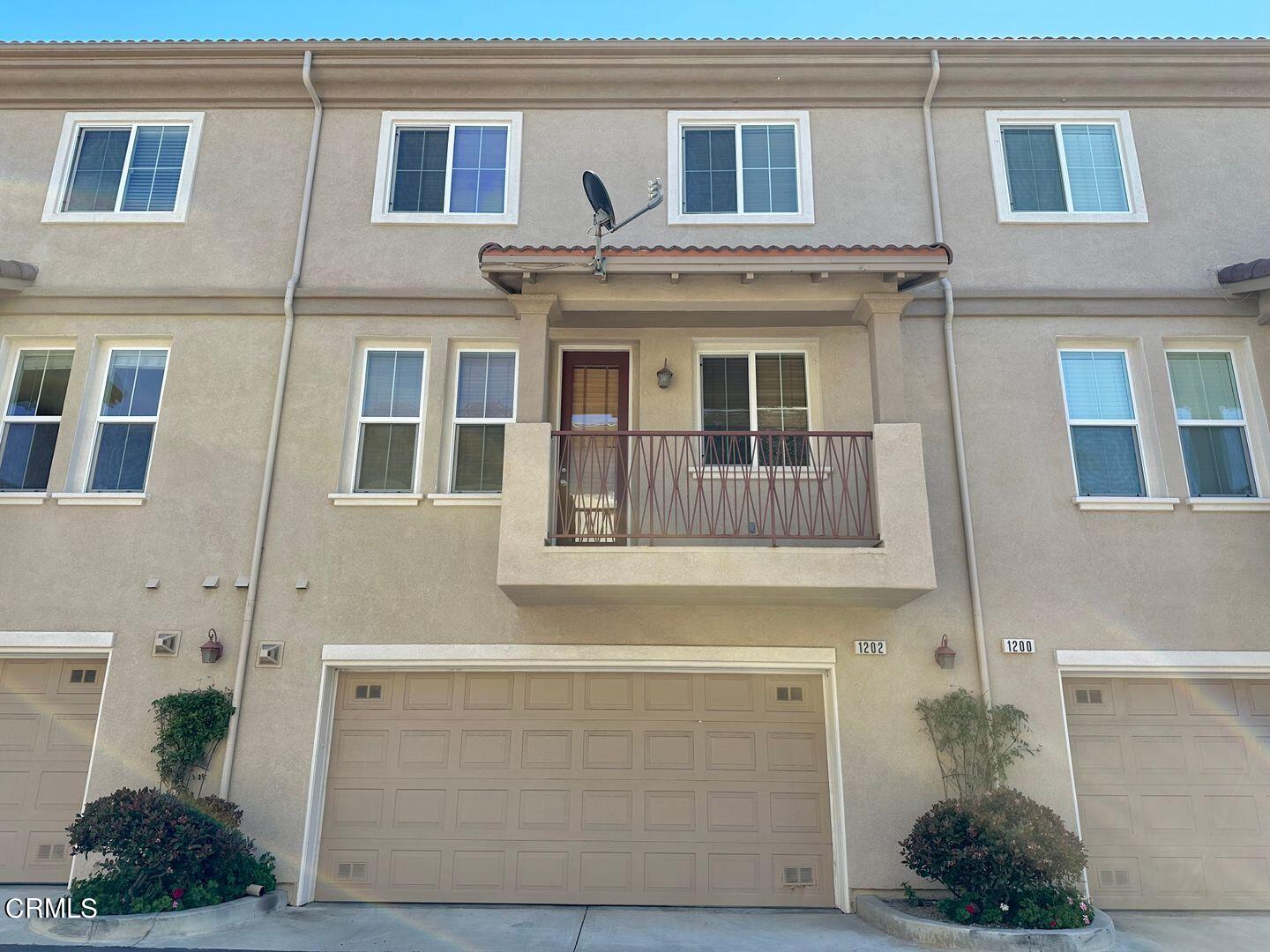 1202 Bayside Circle Oxnard, CA 93035 - Photo 45 of 48 a front view of a house with a yard