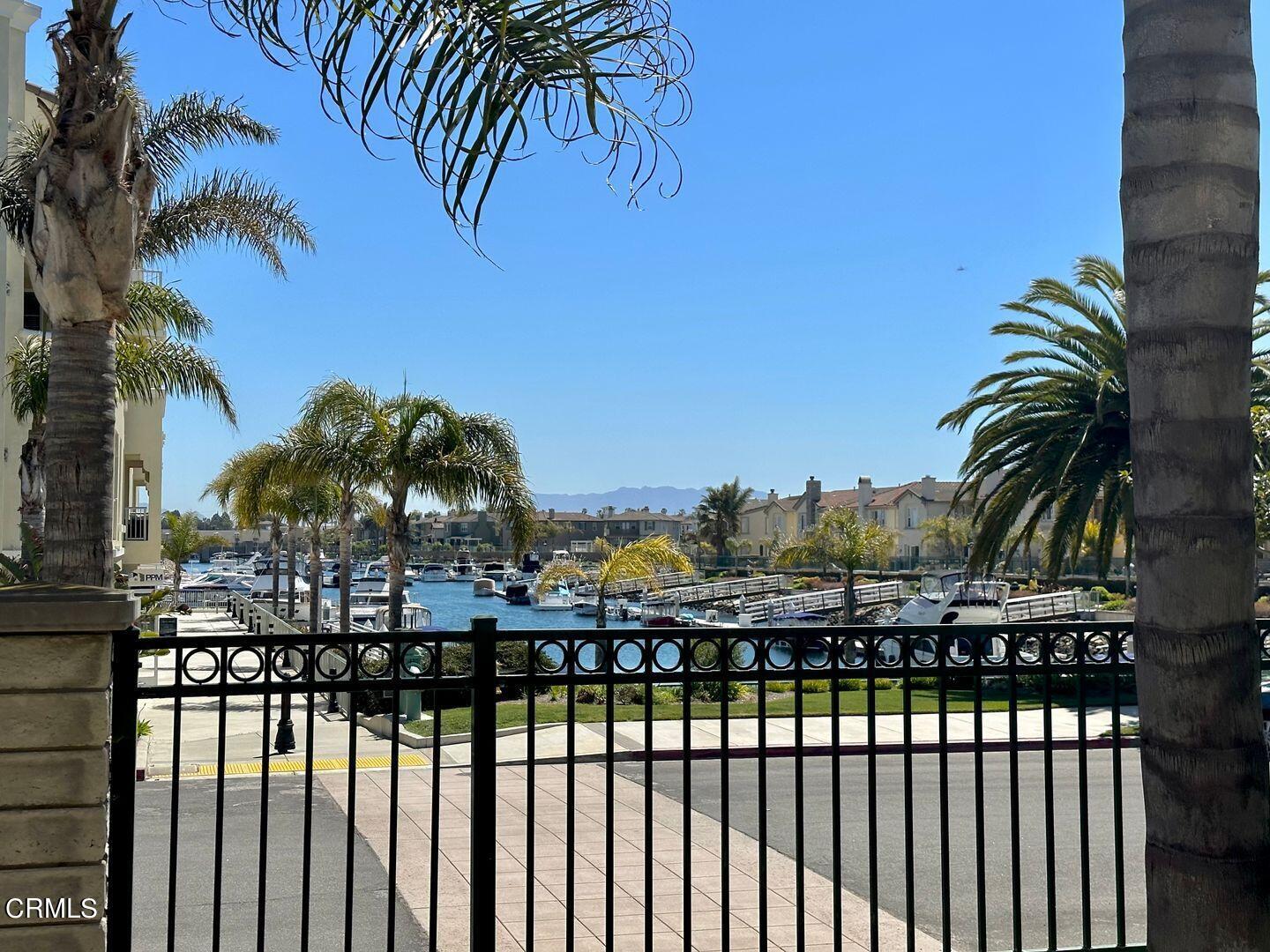 1202 Bayside Circle Oxnard, CA 93035 - Photo 47 of 48 a view of a balcony with palm trees