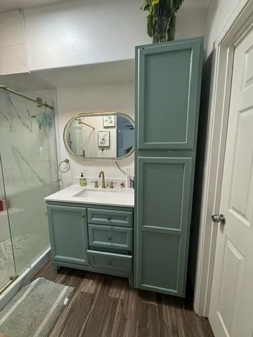a bathroom with a sink and a mirror