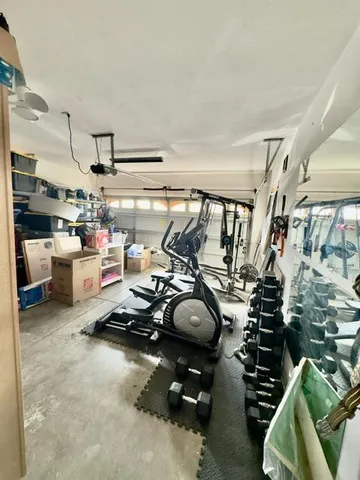 a gym room with lots of gym equipment