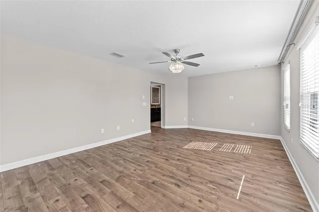 a view of an empty room with a window