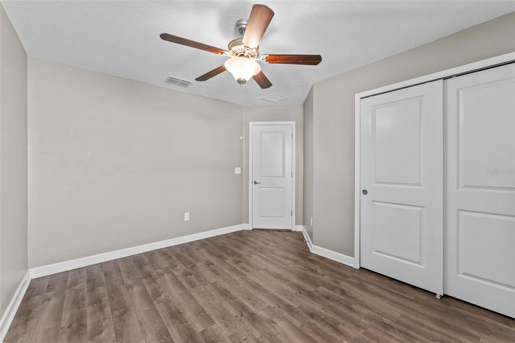 1040 Oliveto Verdi Court Brandon, FL 33511 - Photo 25 of 35 wooden floor in an empty room