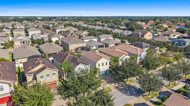 an aerial view of a city with lots of residential buildings