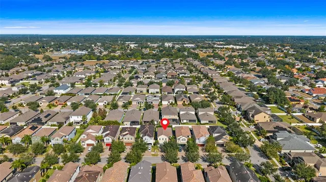 an aerial view of residential building with trees