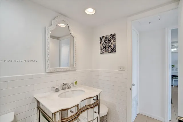 a bathroom with a sink a mirror and a shower