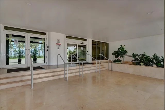 a view of a backyard patio and swimming pool