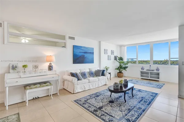 a living room with furniture and a rug